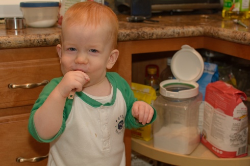 Toddler smiling with sugar spoon