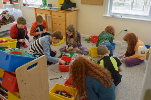 Girls and boys playing legos