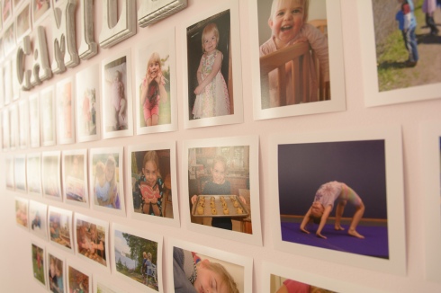 Family photographs hung on wall